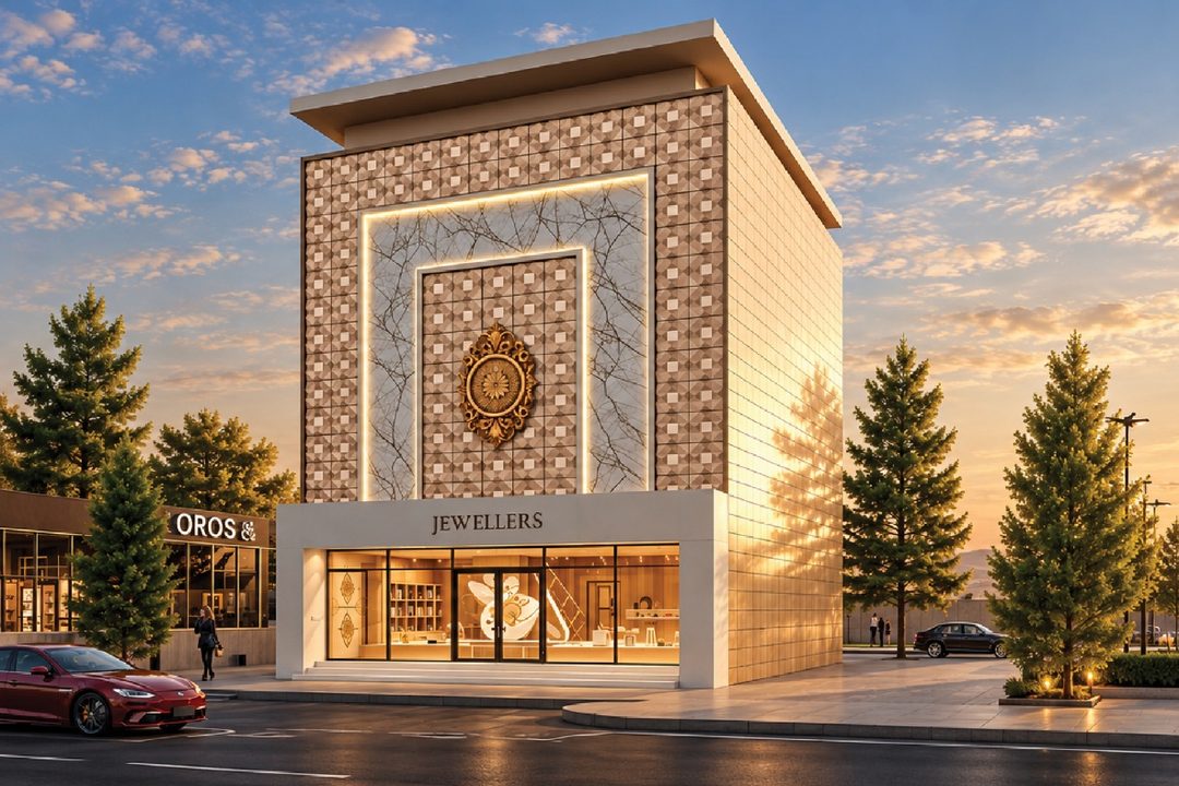 Jewellery showroom with a tall frontage of patterned ACP panels framing a marble-effect centre panel and an ornamental emblem